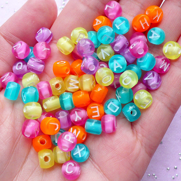 Premium Photo  Plastic beads with letters